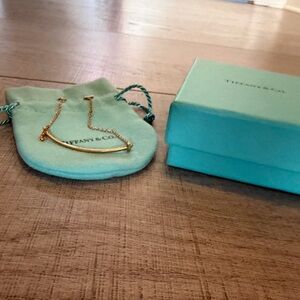 Tiffany & Co. Gold Curved Bar bracelet with Blue Pouch